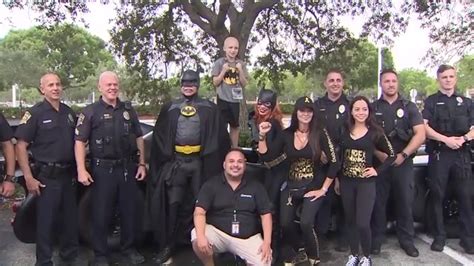 Hero for a day: 8-year-old boy battling cancer gets to ride Batmobile to go see ‘The Flash’ in Davie
